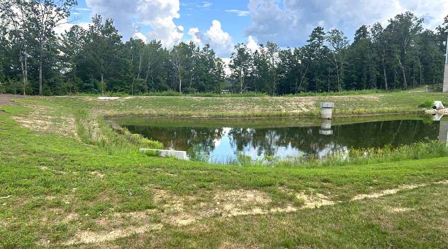 Stormwater detention pond with riser structure — Southeast land development