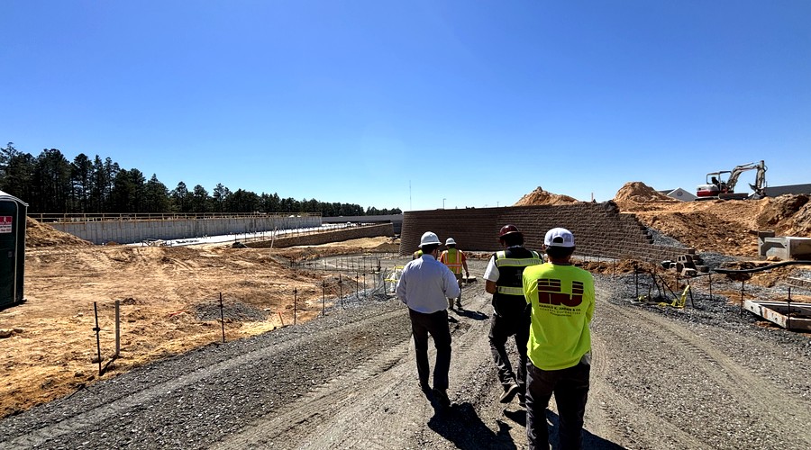 Engineers conducting field inspection at active civil construction site