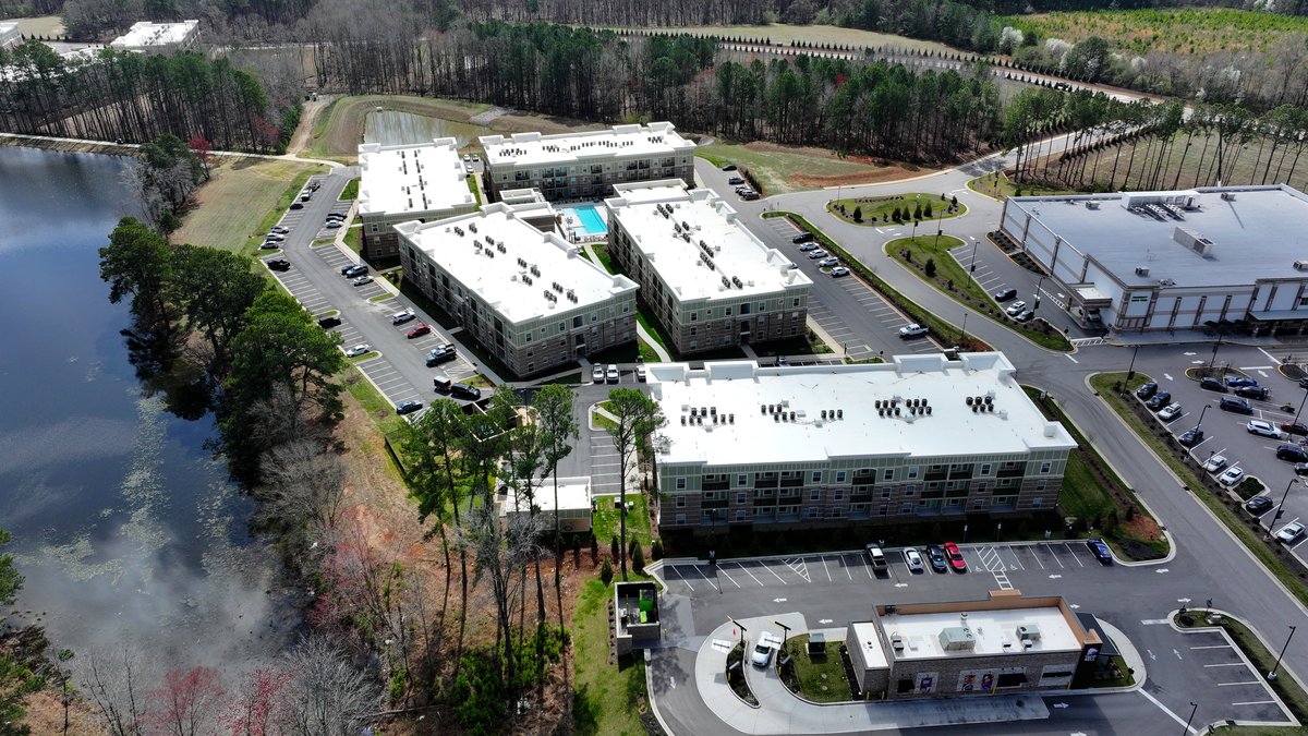Aerial view of Flowers multifamily development with stormwater pond — Hagen Engineering